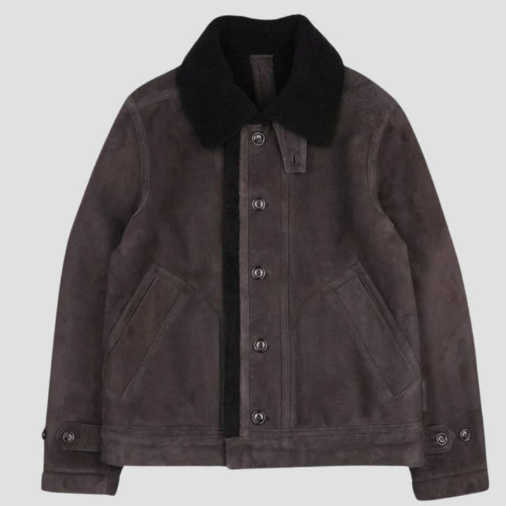 This black fur jacket with suede leather offers the perfect combination of warmth and high-end style for winter fashion.