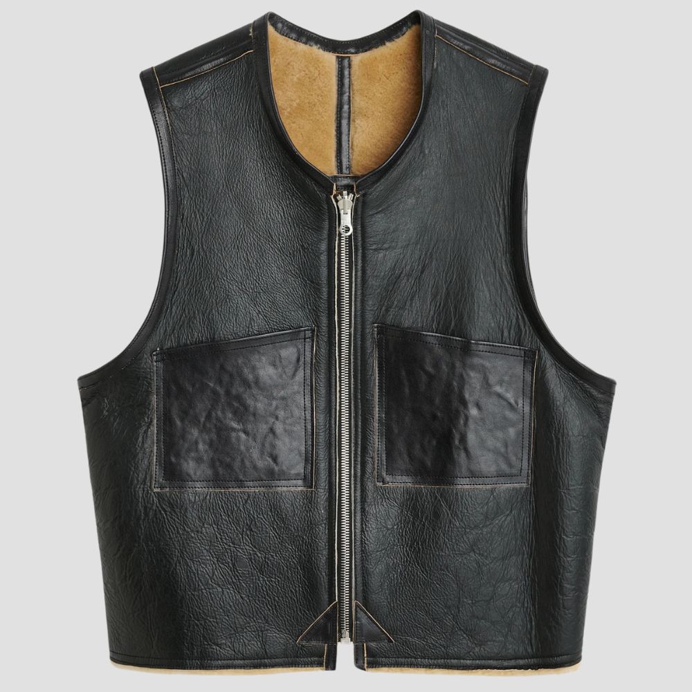 Stylish black leather vest with cozy faux fur lining for colder weather.