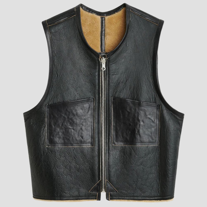 Stylish black leather vest with cozy faux fur lining for colder weather.