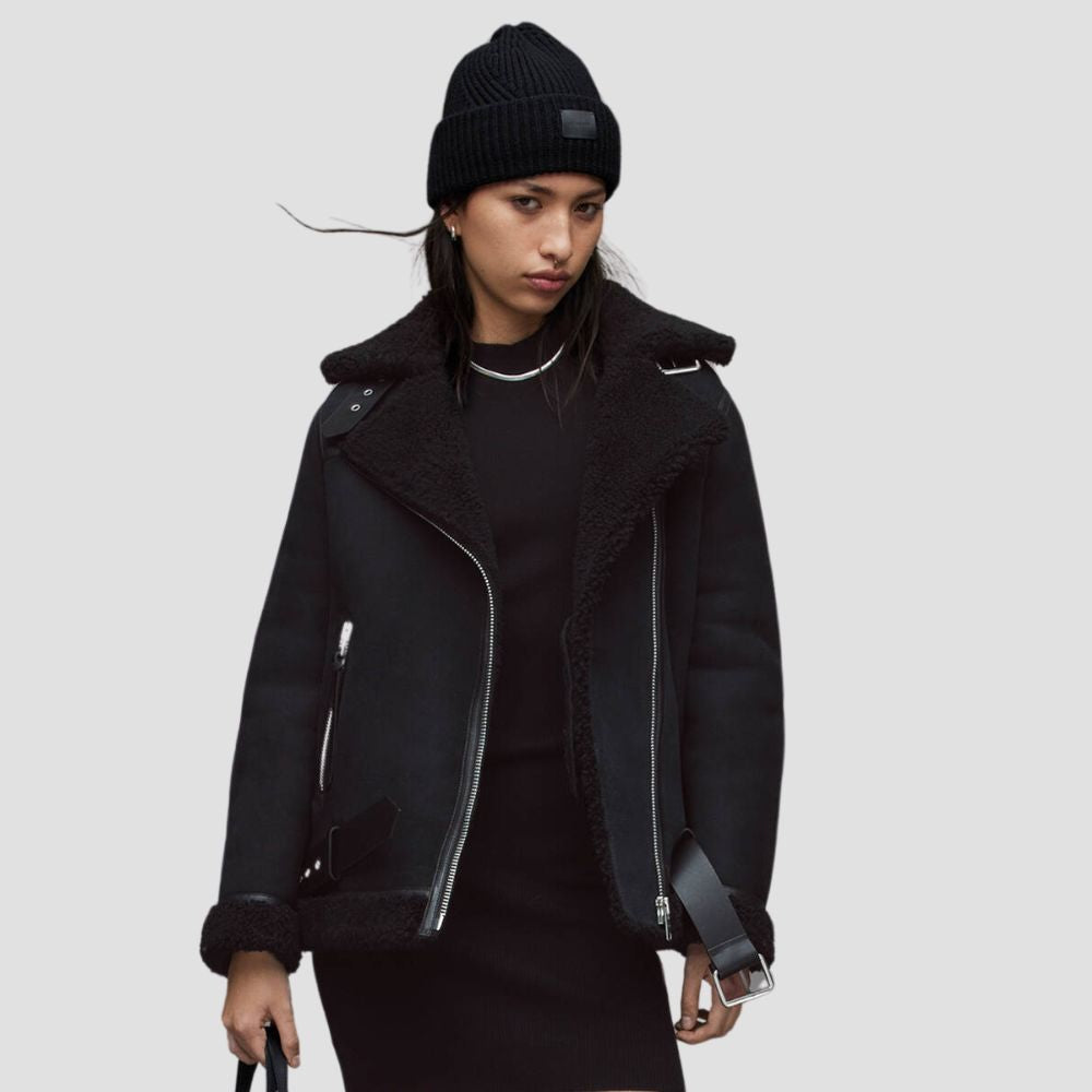 Shop a women’s shearling leather jacket for bold winter fashion trends. The soft shearling lining and sleek leather exterior create a stylish and warm winter look.