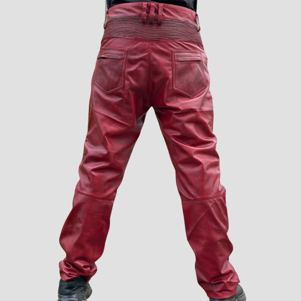 Men’s bold red leather biker pants with a sleek and edgy design.