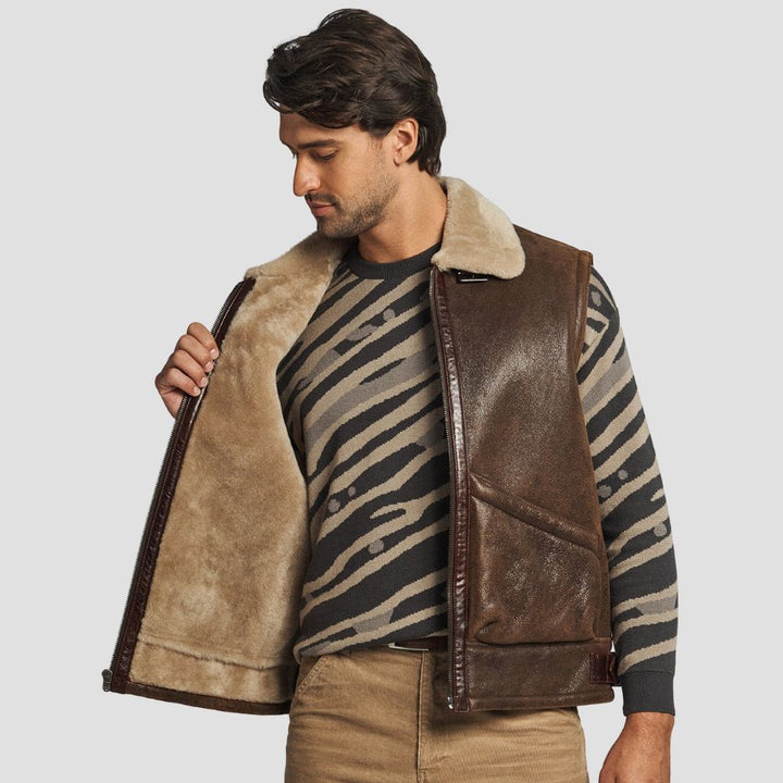 Men’s brown leather vest with fluffy shearling interior for casual wear.