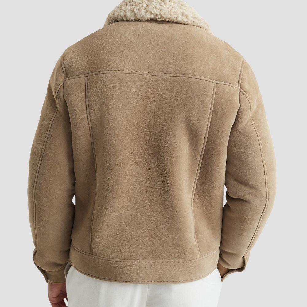 Elevate your winter wardrobe with this stylish suede bomber jacket, featuring a luxurious curly fur lining for added comfort.
