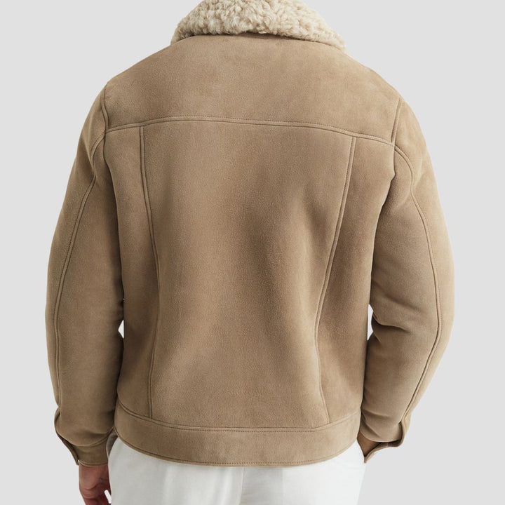 Elevate your winter wardrobe with this stylish suede bomber jacket, featuring a luxurious curly fur lining for added comfort.