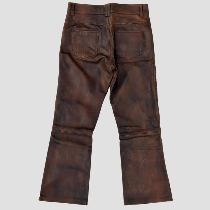 Men’s vintage-style distressed leather pants, perfect for casual wear.