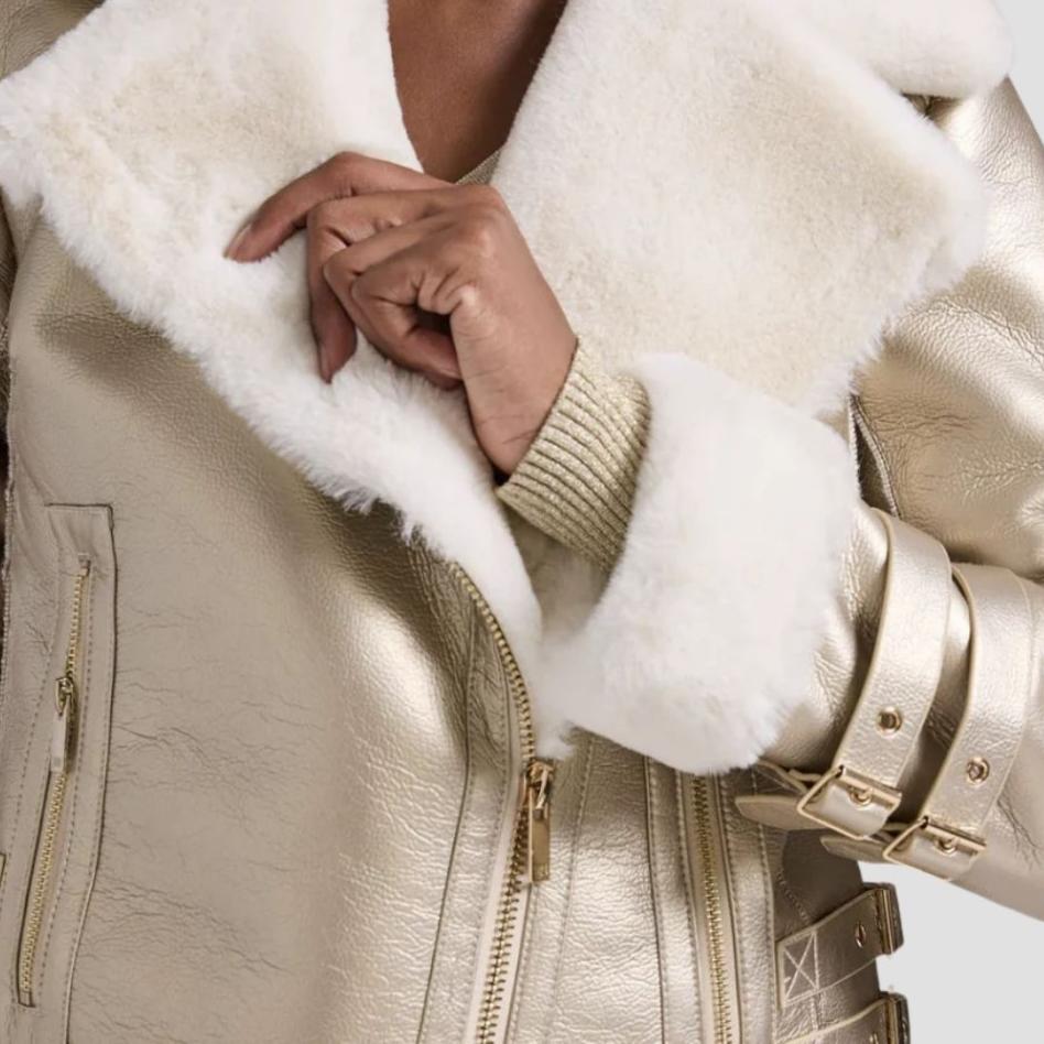  Elevate your wardrobe with a soft-touch women’s fur leather metallic jacket. The blend of metallic leather and plush fur creates a modern, fashionable winter outwear.
