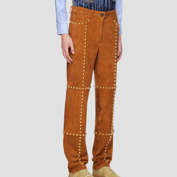Men’s edgy studded suede leather pants, perfect for bold and unique style.