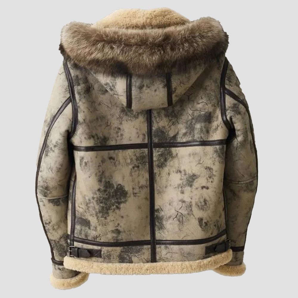 Wrap yourself in warmth and elegance with this shearling-lined leather jacket, featuring a cozy fur hoodie for chilly days.