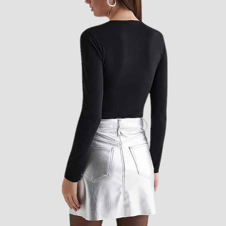 This silver metallic skirt offers an elegant, modern look for women. Perfect for adding a reflective, stylish element to your evening or day-to-night wardrobe.