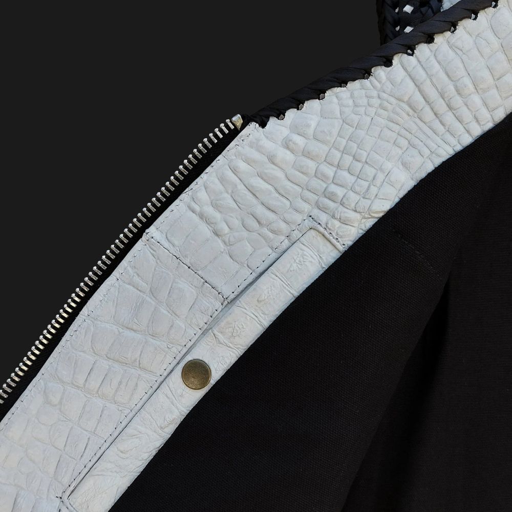 Crocodile embossed white leather vest in biker style for standout fashion.