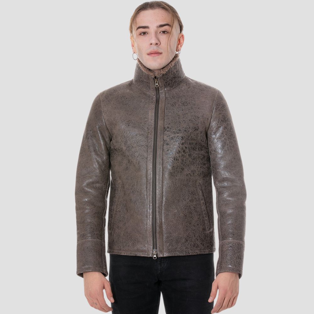 Vintage distressed sheepskin leather jacket with cozy faux fur interior.