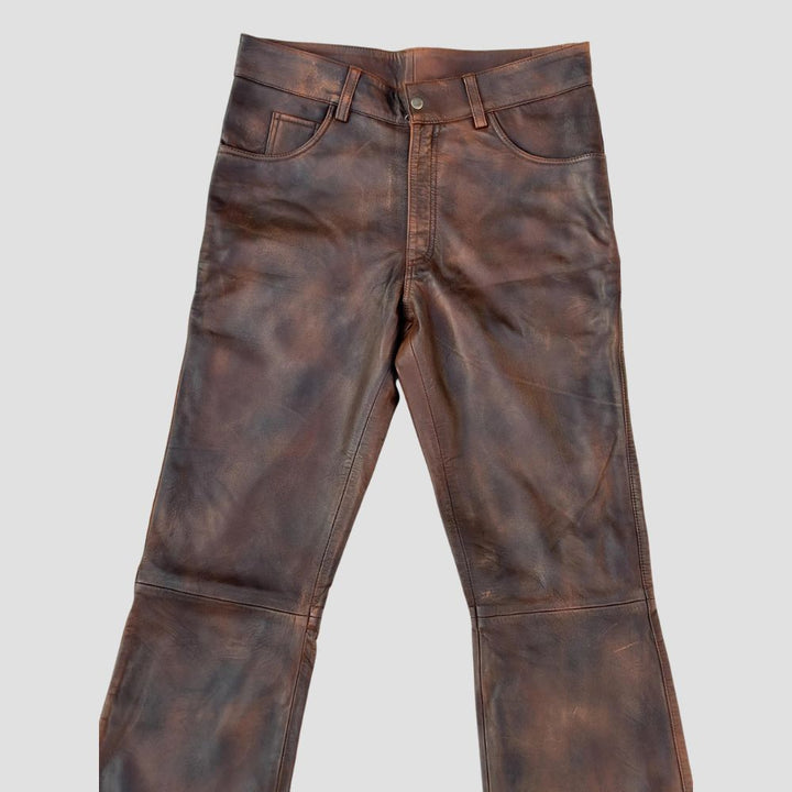 Rugged, stylish distressed sheepskin leather pants for men’s wardrobe.
