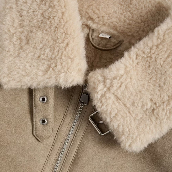 Take on outdoor adventures in style with this women’s Sherpa leather jacket. The Sherpa lining keeps you warm, while the leather exterior provides a fashionable edge.