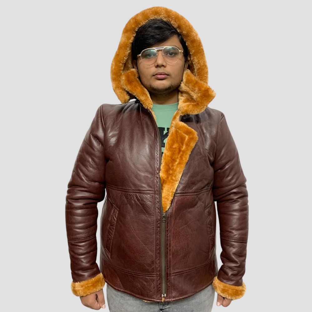 This premium leather jacket features a cozy shearling lining and a fur hoodie for ultimate warmth and style.