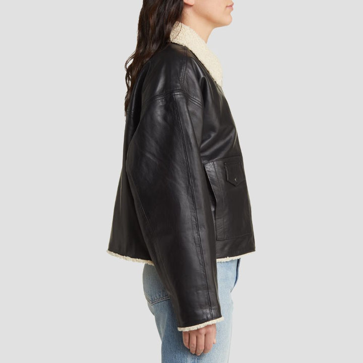 This soft shearling leather jacket for ladies is designed for ultimate winter warmth. The plush shearling lining and smooth leather exterior ensure you stay warm and fashionable during winter.