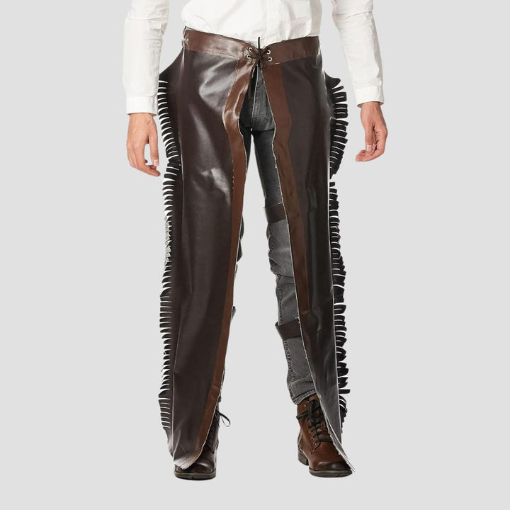 Perfect for ranch work or rodeo events, these premium fringe leather chaps embody timeless cowboy charm.