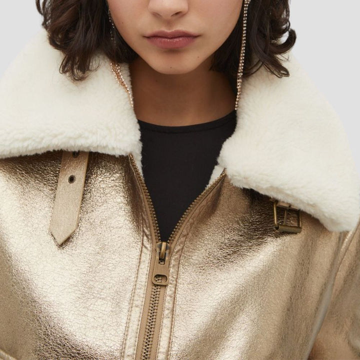 This sleek metallic jacket for women is the perfect choice for a fashion-forward look. The modern metallic finish and flattering design make it a must-have for any trendy wardrobe.