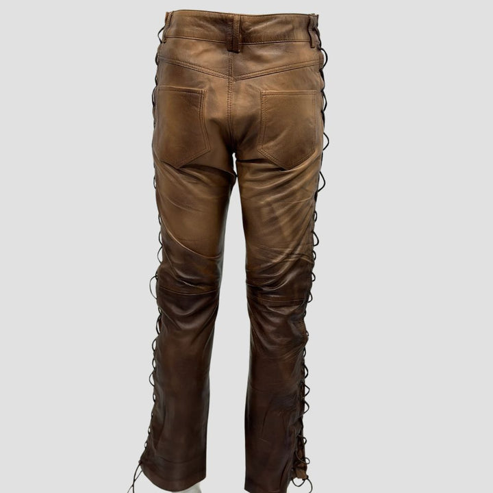 Biker-style distressed leather pants with a vintage wax finish, perfect for riders.