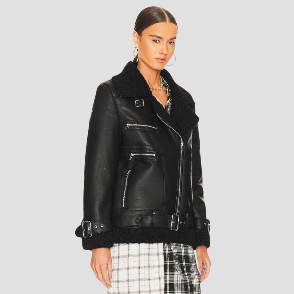  This women’s shearling leather jacket brings modern winter fashion to life. The cozy shearling lining and stylish leather exterior make it perfect for cold weather and fashion.