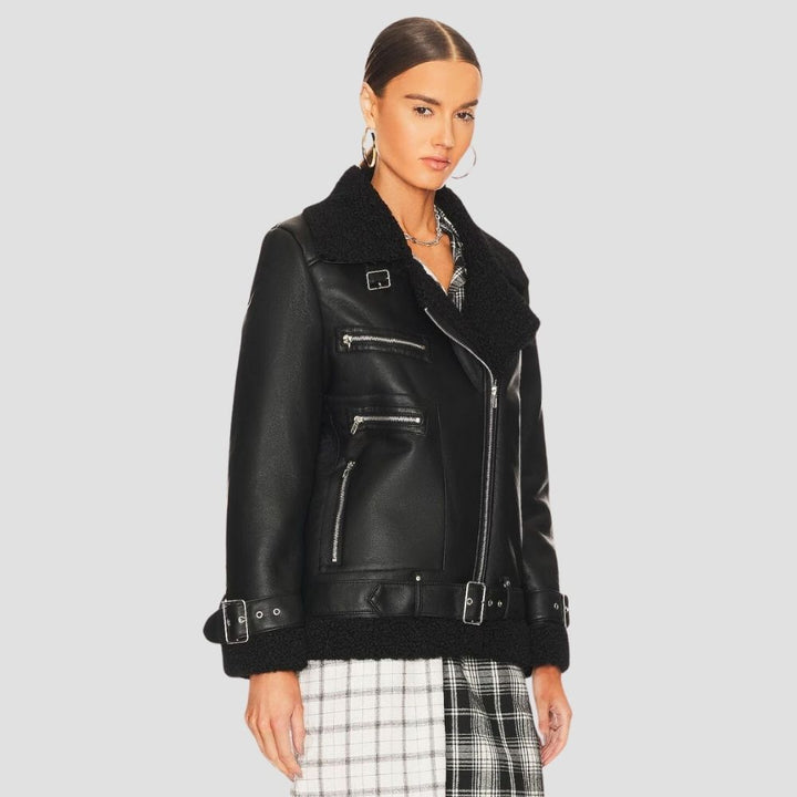  This women’s shearling leather jacket brings modern winter fashion to life. The cozy shearling lining and stylish leather exterior make it perfect for cold weather and fashion.