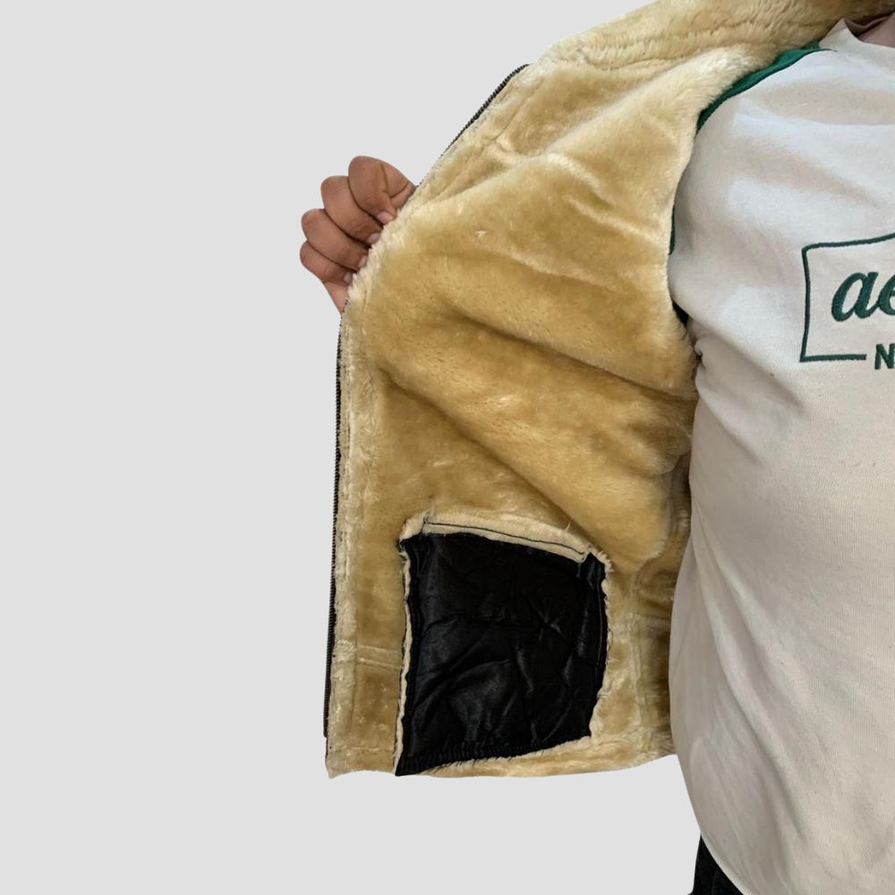 A perfect fusion of rugged lambskin leather and soft shearling, providing both warmth and trendy flair for your winter looks.