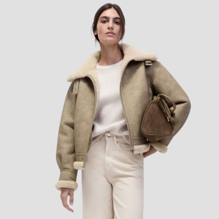 Stay warm and chic during outdoor adventures with this women’s Sherpa leather jacket. The luxurious Sherpa lining and leather design provide both comfort and style.