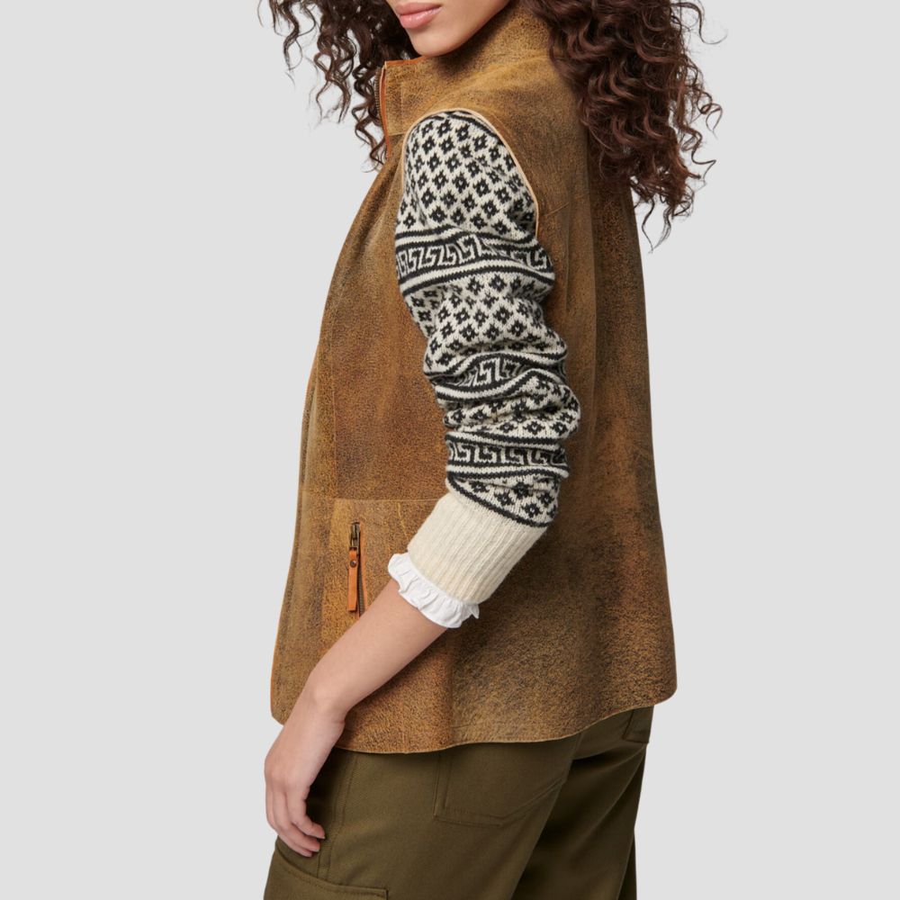 Cozy suede fur-lined vest for women, blending fashion and comfort with its chic and modern design.