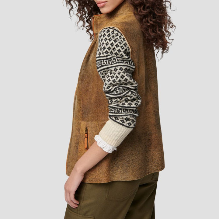 Cozy suede fur-lined vest for women, blending fashion and comfort with its chic and modern design.