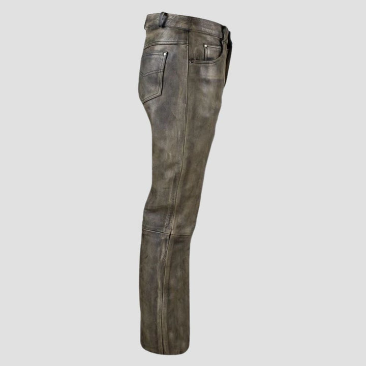 Rugged and stylish distressed leather pant in biker style for everyday use.