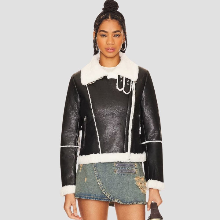 This women’s fur leather jacket is perfect for versatile cold weather fashion. Combining soft fur with sleek leather, it offers warmth and chic style for any occasion.