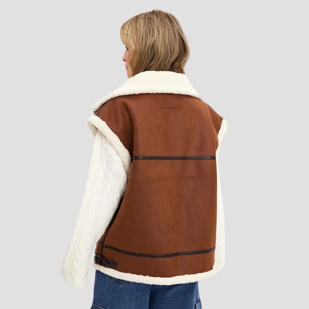 Cozy up in this soft leather shearling vest for women, providing warmth and effortless style for a fashionable winter look.