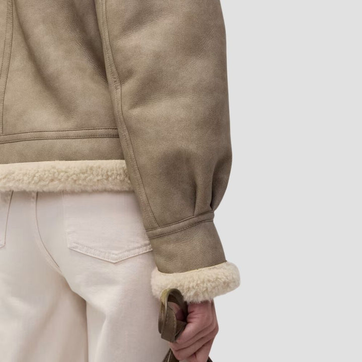 Shop this women’s Sherpa leather jacket for the perfect blend of warmth and style. Ideal for outdoor adventures, it combines Sherpa comfort with a sleek leather look.